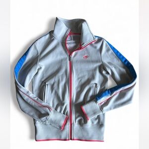 Nike track jacket off-white with blue and pink accents. Women’s Size Medium